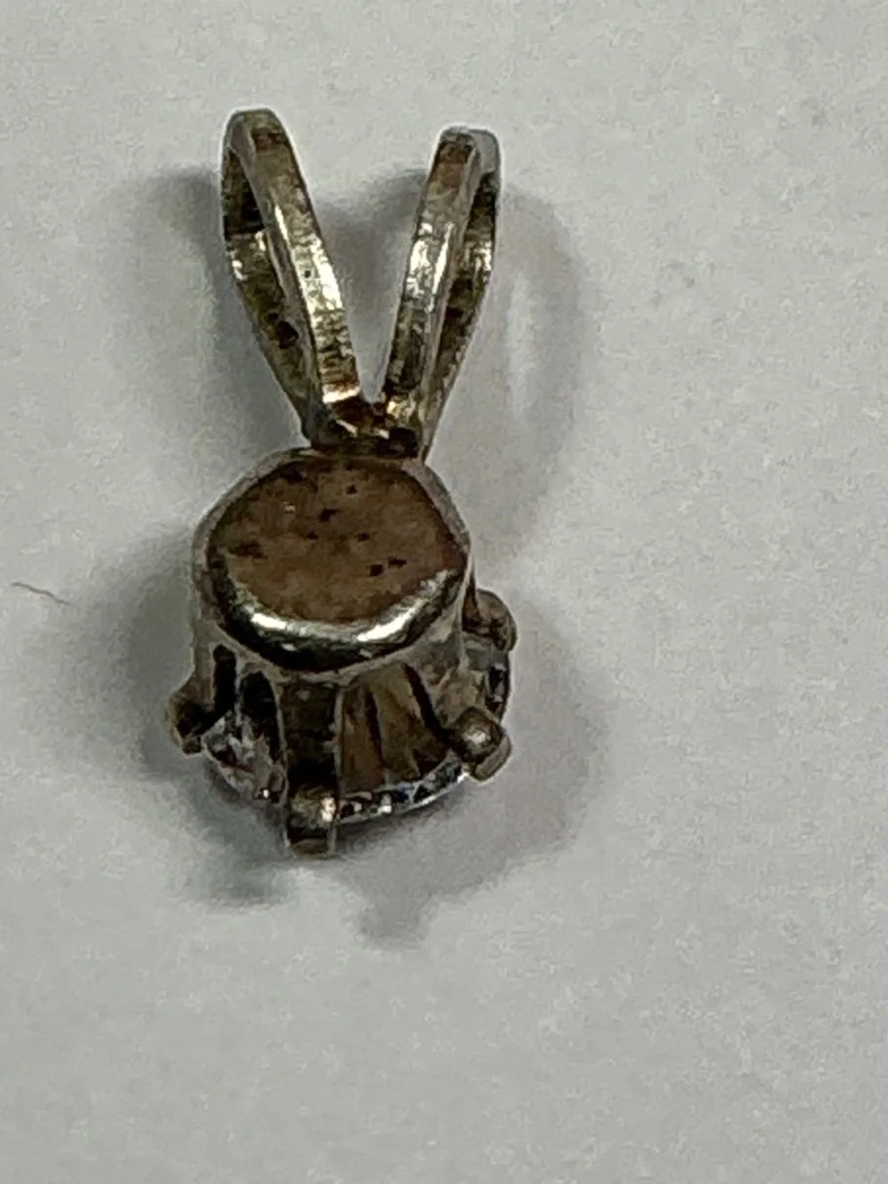 Sterling Silver Petite Pendant with a clear stone. 1/2 inches long
